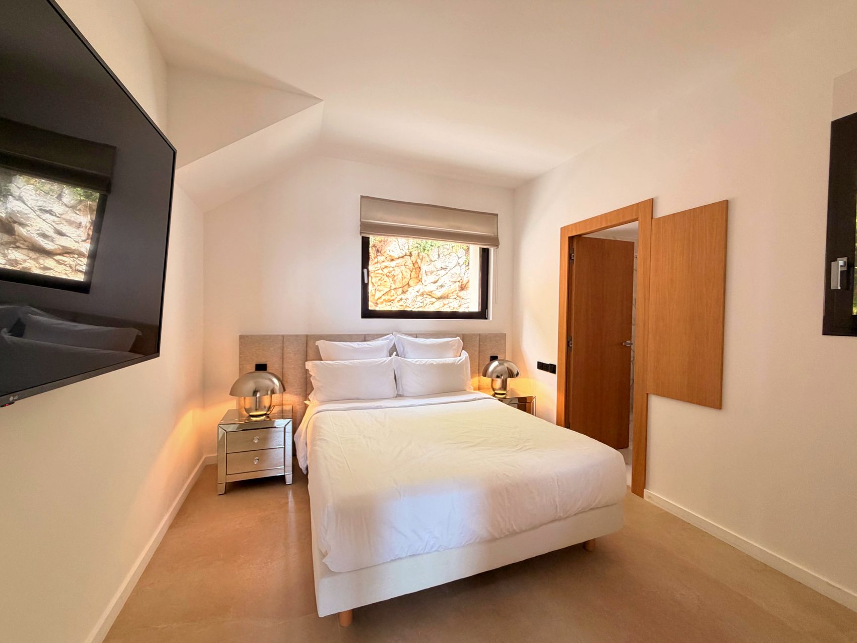 A restful double bedroom in soft neutral tones