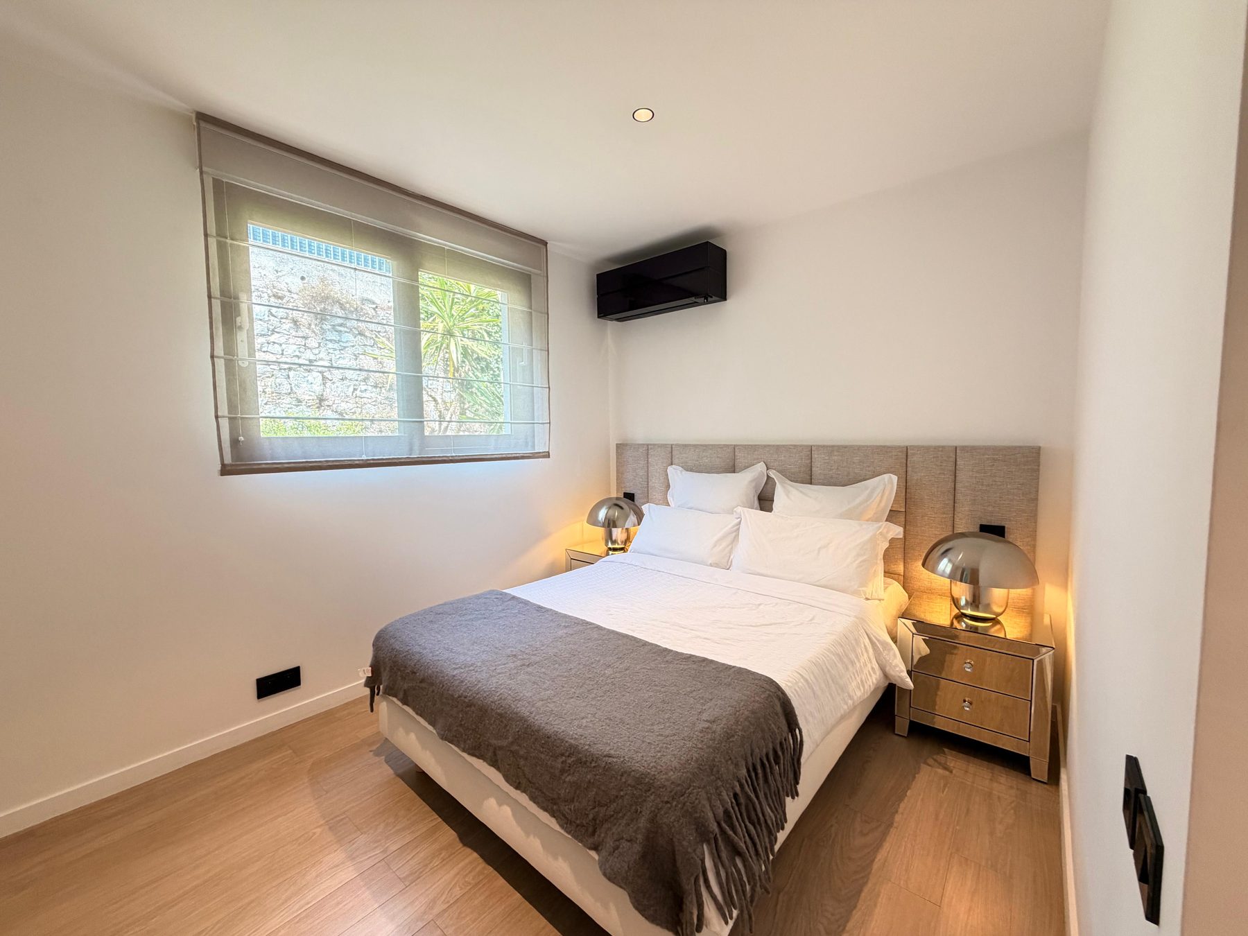 A second double bedroom in soft neutral tones